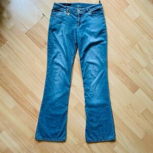 Gucci low rise Blue Flare Women's Jeans with gold charm embellishment